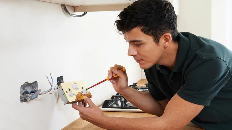 A plug being wired